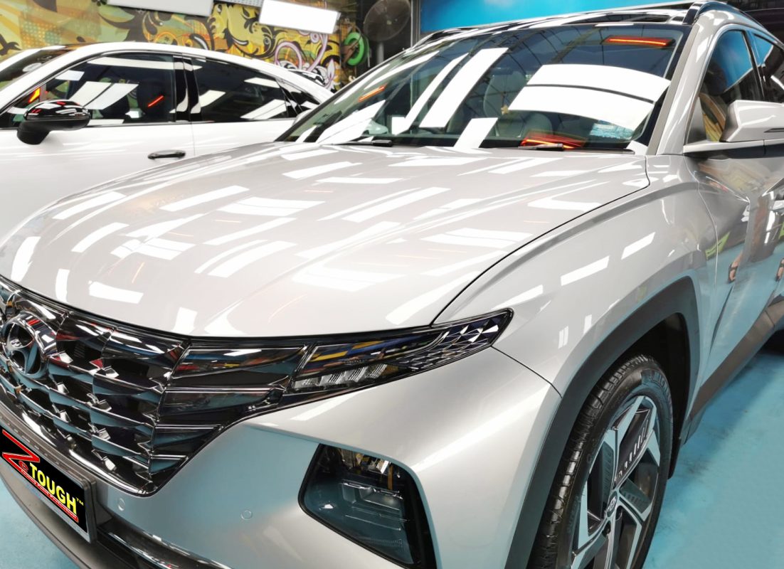 The Hyundai NX4E Tucson from a side angle after the ceramic coating.