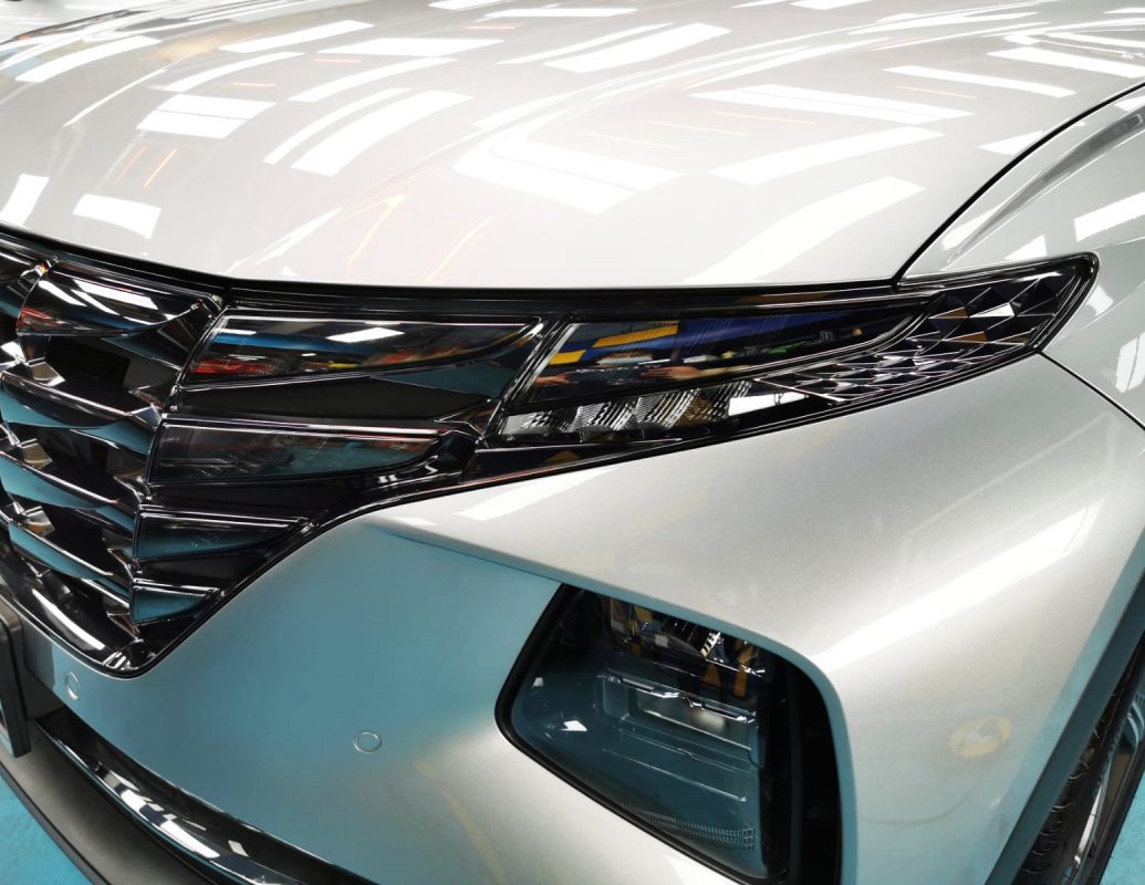 The Tucson's coated paintwork showing clean reflections.