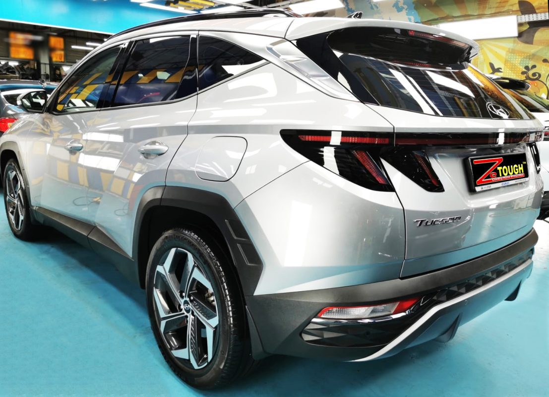 Rear quarter of the Hyundai NX4E Tucson, glossy and protected.