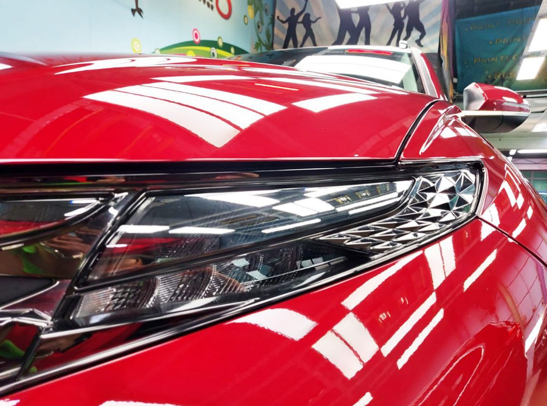 The NX4E Tucson's coated paintwork showing clean reflections.