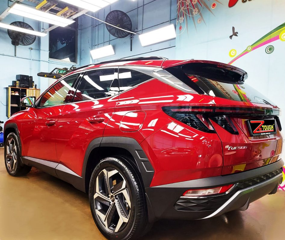 Rear quarter of the Hyundai NX4E Tucson, glossy and protected.