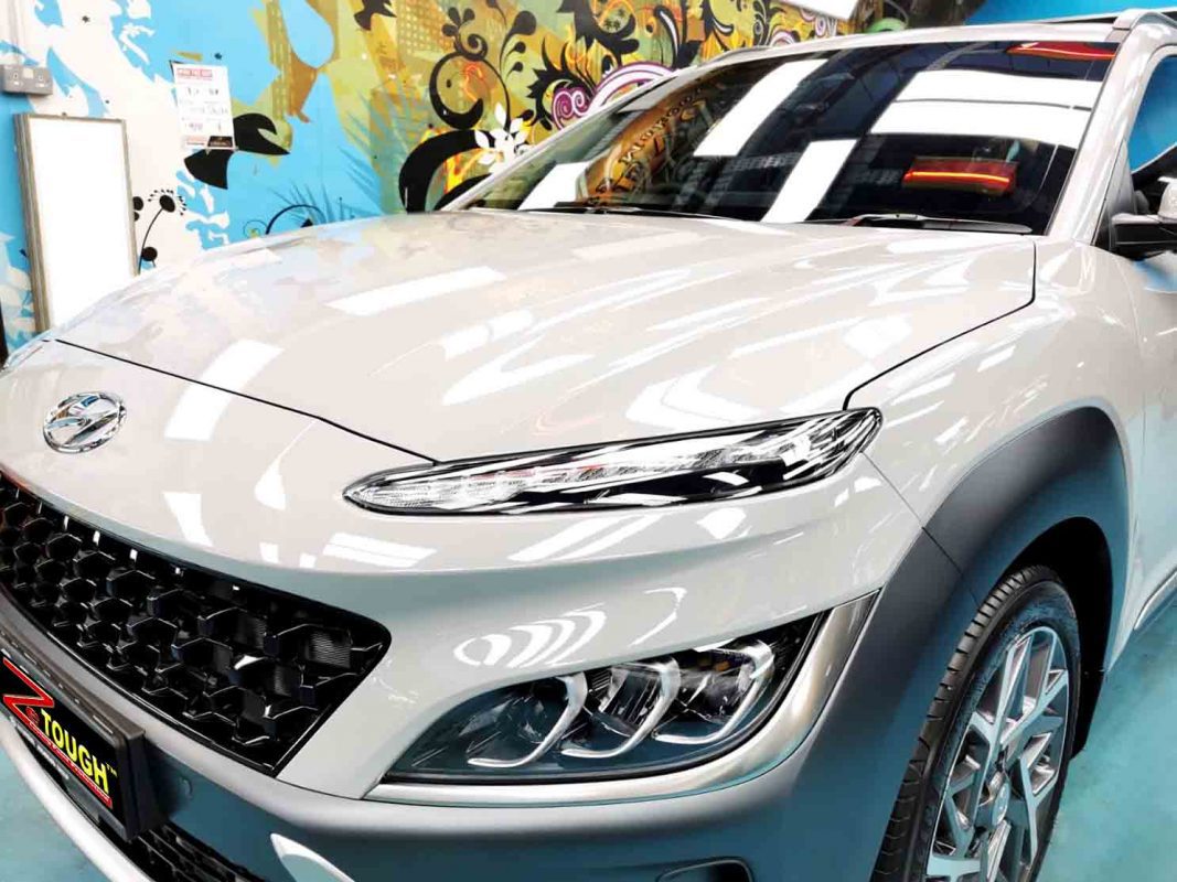 The Hyundai OS Kona HEV from a side angle after the titanium coating.