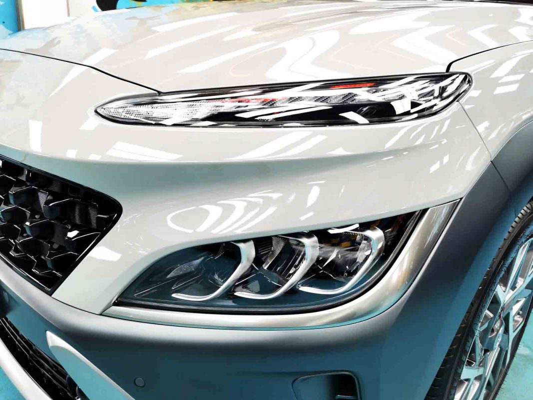 The Kona HEV's coated paintwork showing clean reflections.