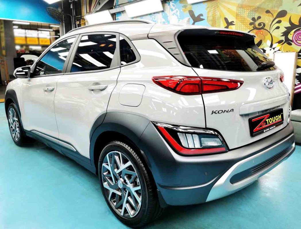 Rear quarter of the Hyundai OS Kona HEV, glossy and protected.