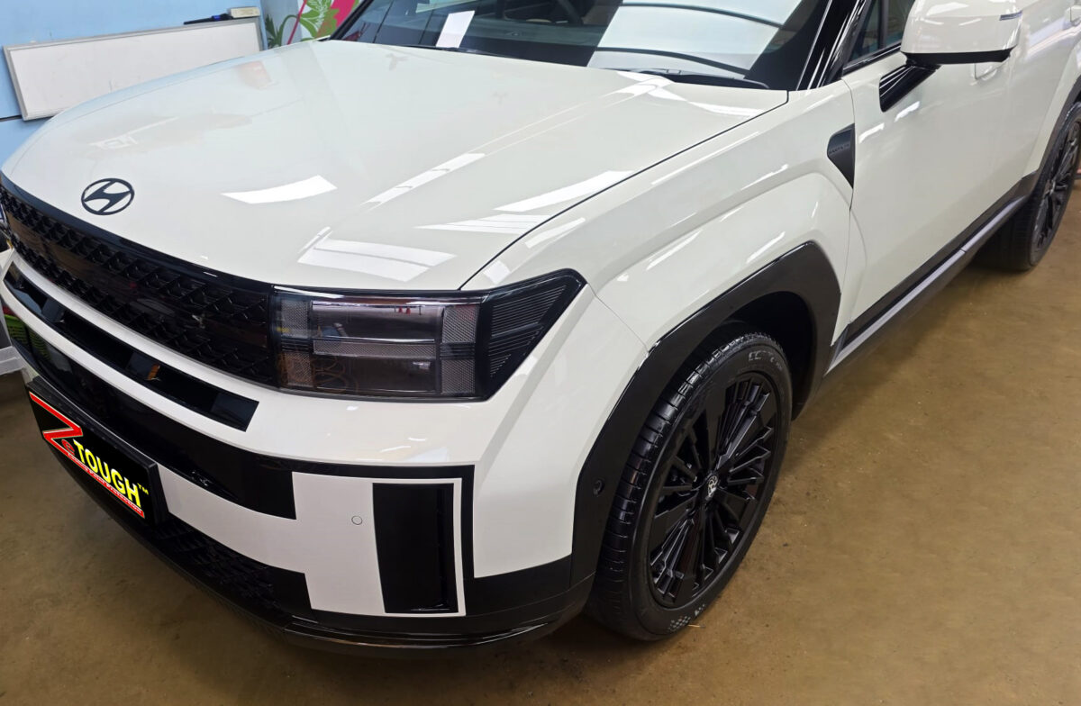 The Hyundai Santa Fe's coated paintwork under workshop lighting.