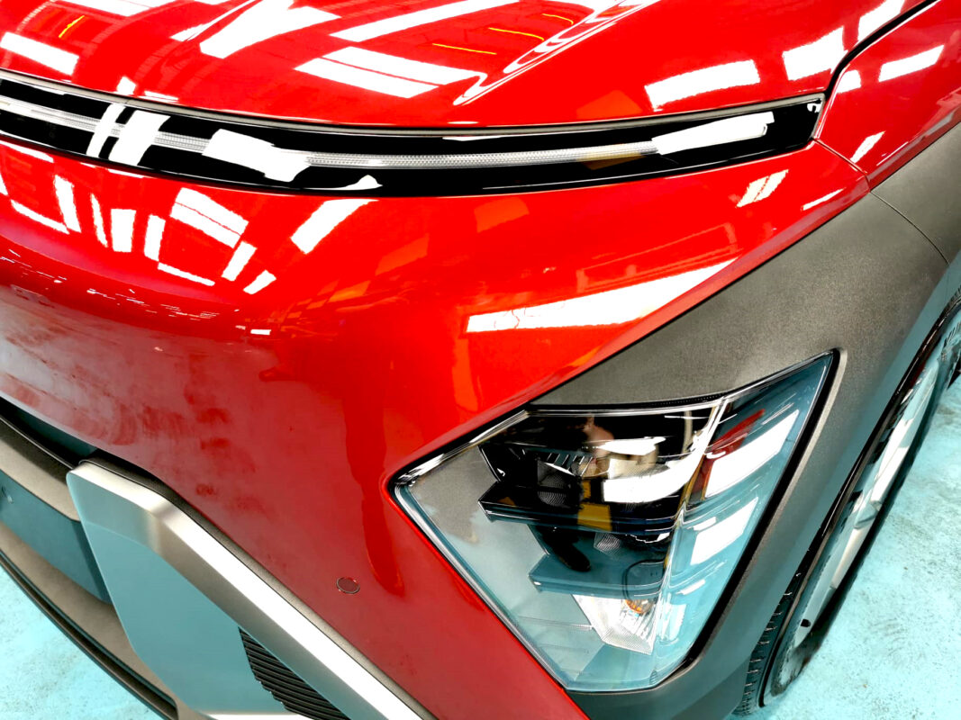 The SX2 Kona's coated paintwork showing clean reflections.