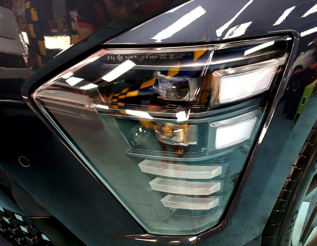 The SX2 Kona's coated paintwork showing clean reflections.
