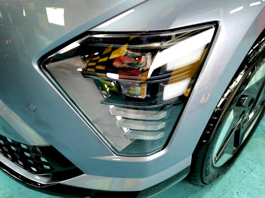 The SX2 Kona's coated paintwork showing clean reflections.
