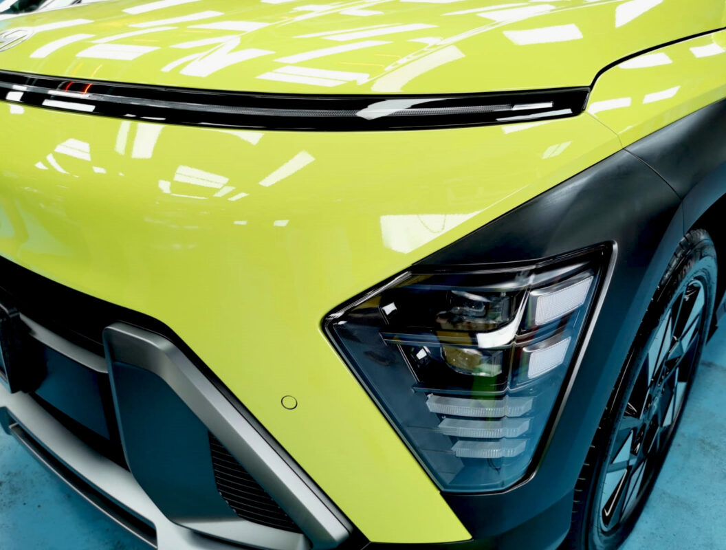 The SX2 Kona's coated paintwork showing clean reflections.