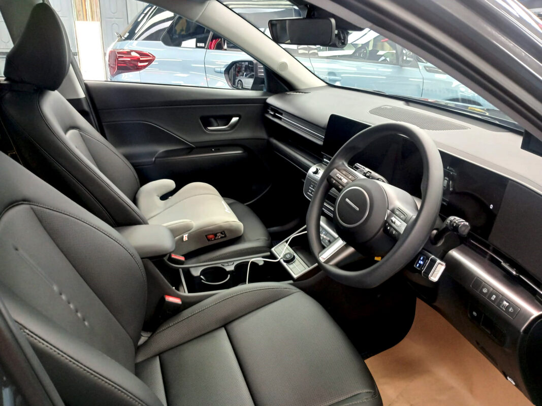 The Hyundai Kona parked in the workshop, freshly coated.