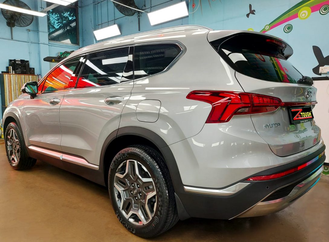 Rear quarter of the Hyundai TM Santa Fe, glossy and protected.