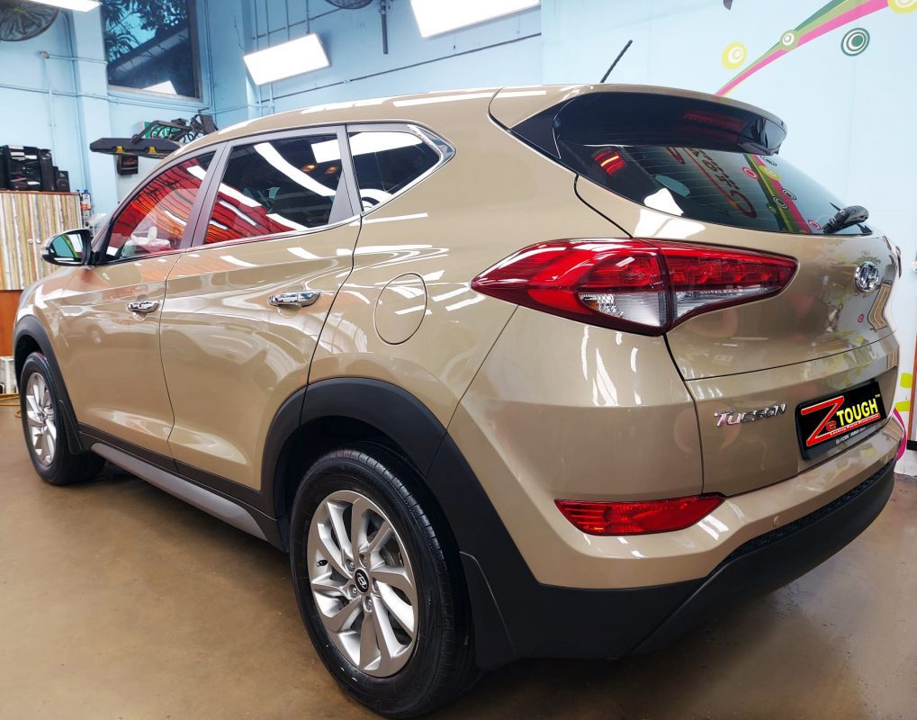 Rear quarter of the Tucson, glossy and protected.