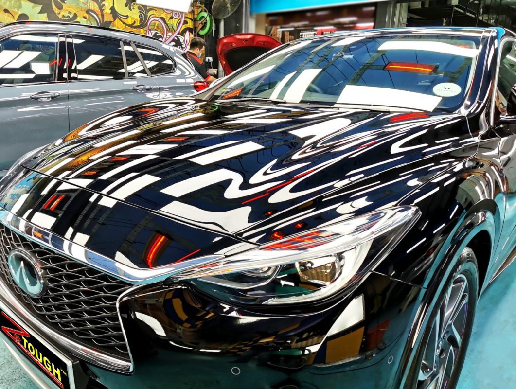 The Infiniti Q30 from a side angle after the ceramic coating.