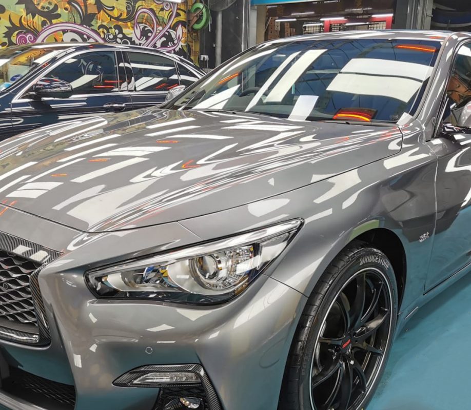 The Infiniti Q50 from a side angle after the ceramic coating.