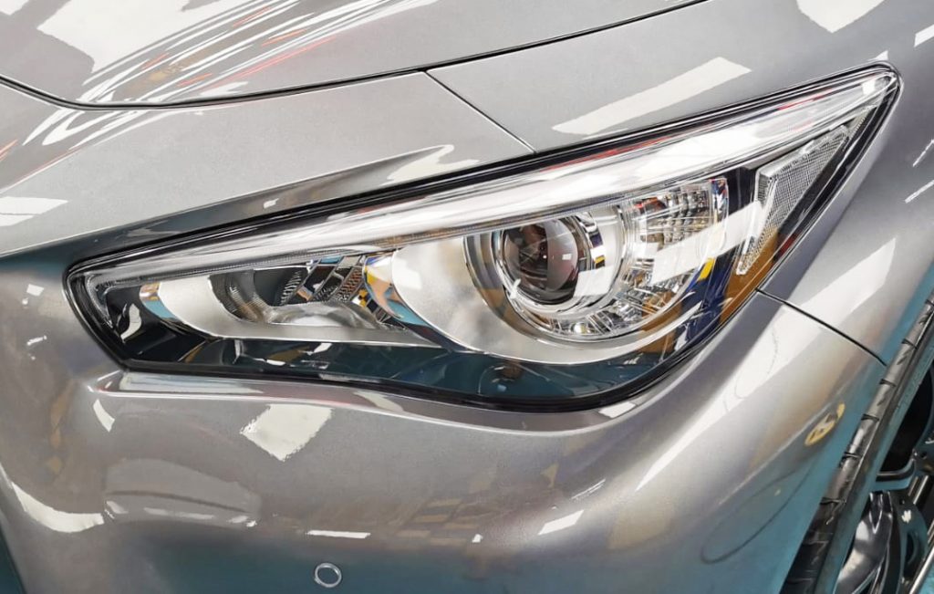 The Q50's coated paintwork showing clean reflections.
