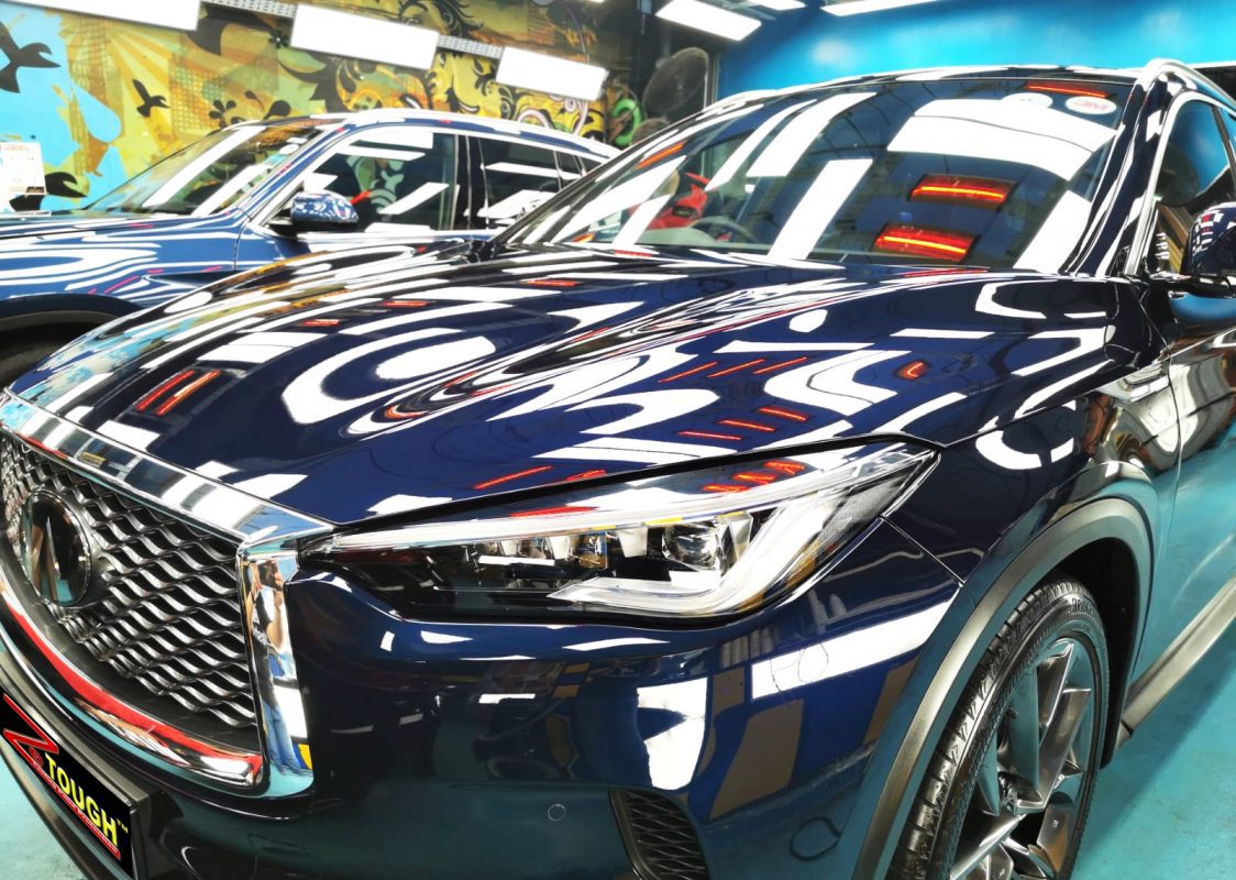 The Infiniti QX50 from a side angle after the ceramic coating.