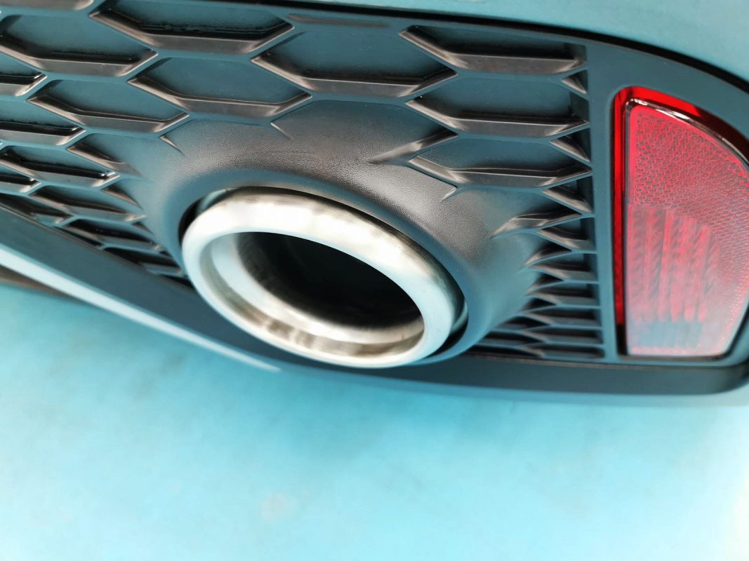 The coated bonnet of the Jaguar E-Pace under workshop lighting.