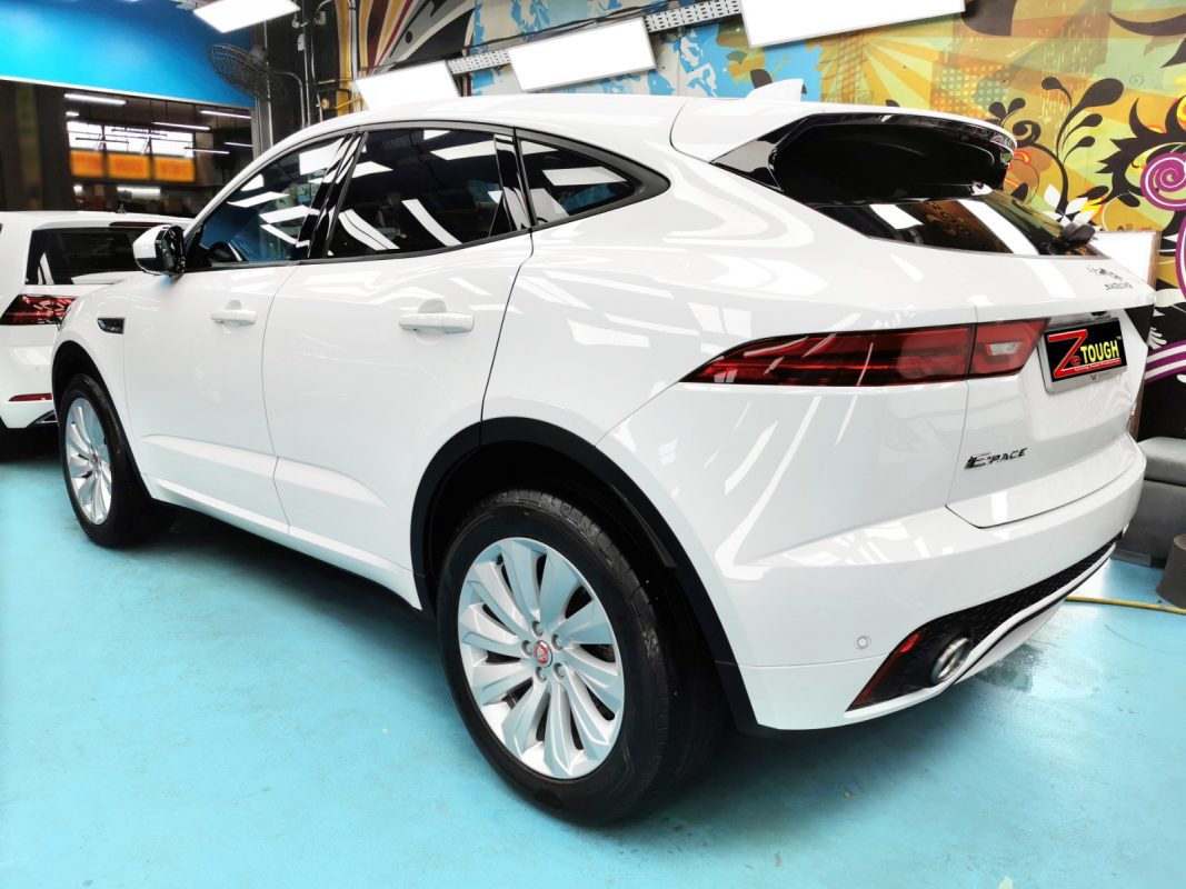 Rear quarter of the white Jaguar E-Pace, glossy and protected.