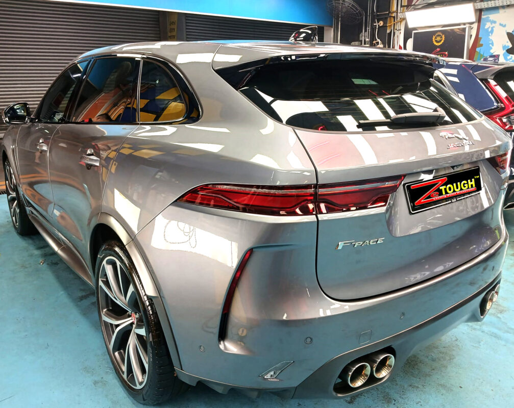 Rear quarter of the Jaguar F-Pace, glossy and protected.