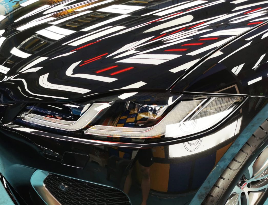 The F-Pace's coated paintwork showing clean reflections.