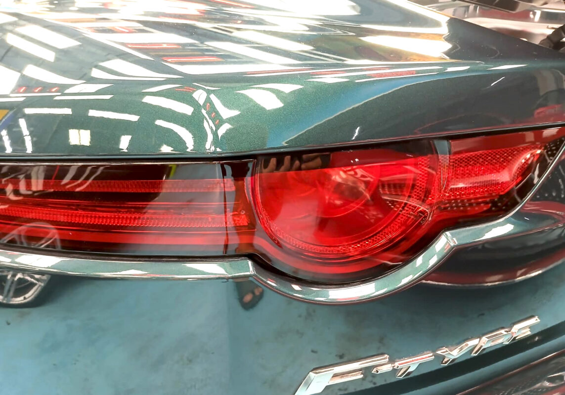 Rear quarter of the Jaguar F-Type, glossy and protected.