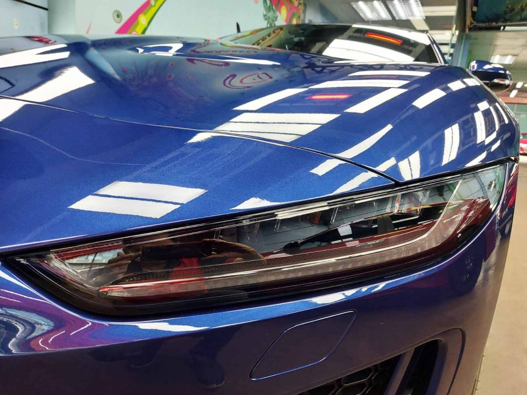 The F-Type's coated paintwork showing clean reflections.
