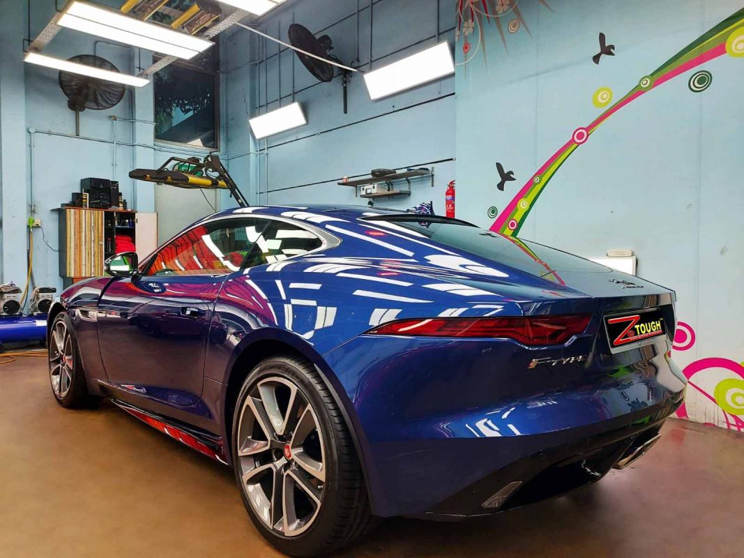 Rear quarter of the Jaguar F-Type, glossy and protected.