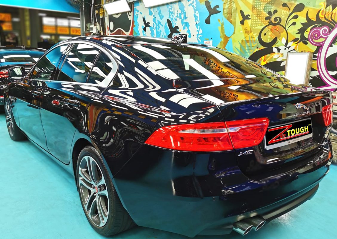 Rear quarter of the Jaguar XE, glossy and protected.