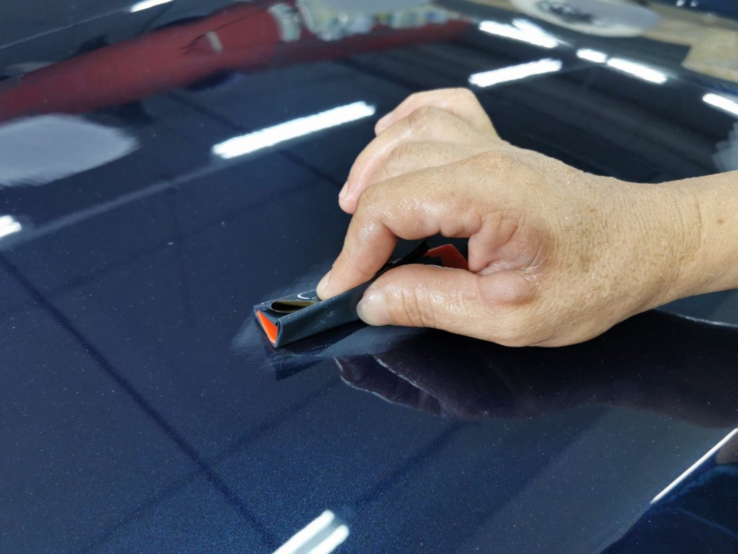The XF being sanded after spraying for an even surface.