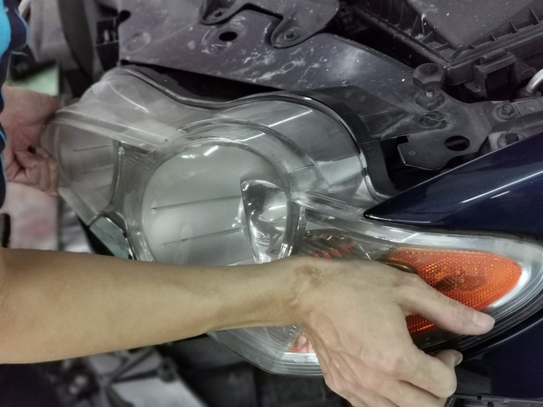 Previously removed car parts being refitted onto the XF.