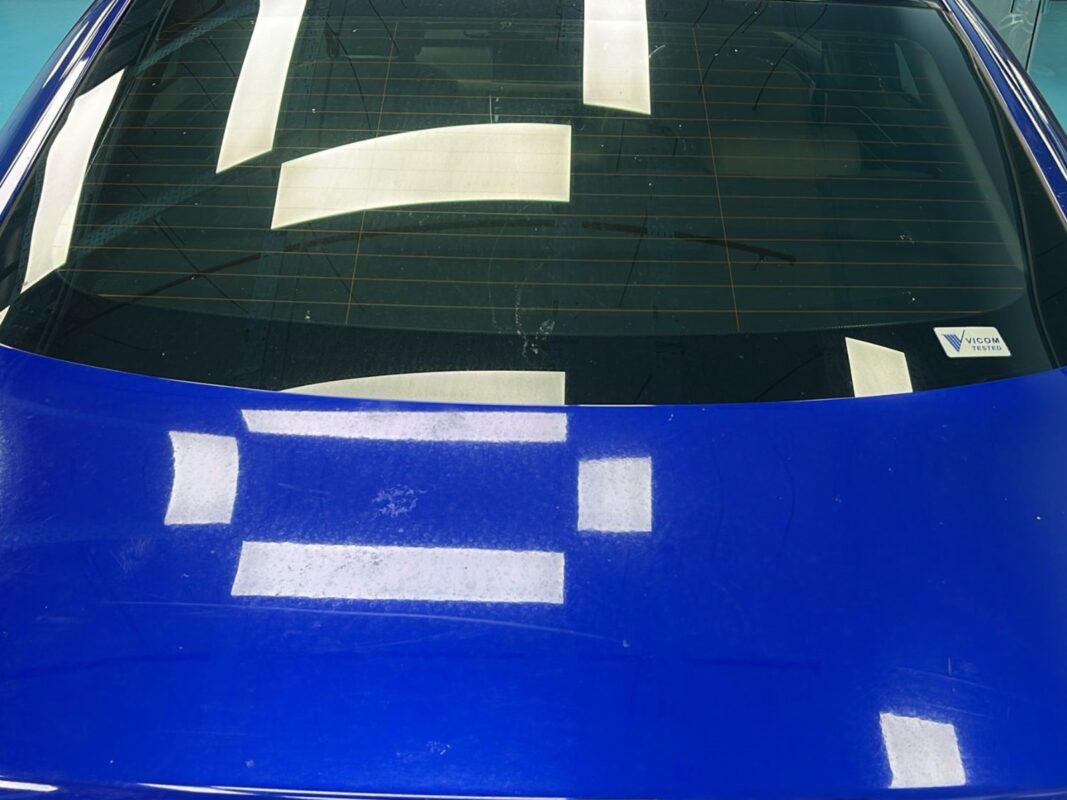 Stonechip and scratch damage on the Jaguar XF panels, before any work begins.