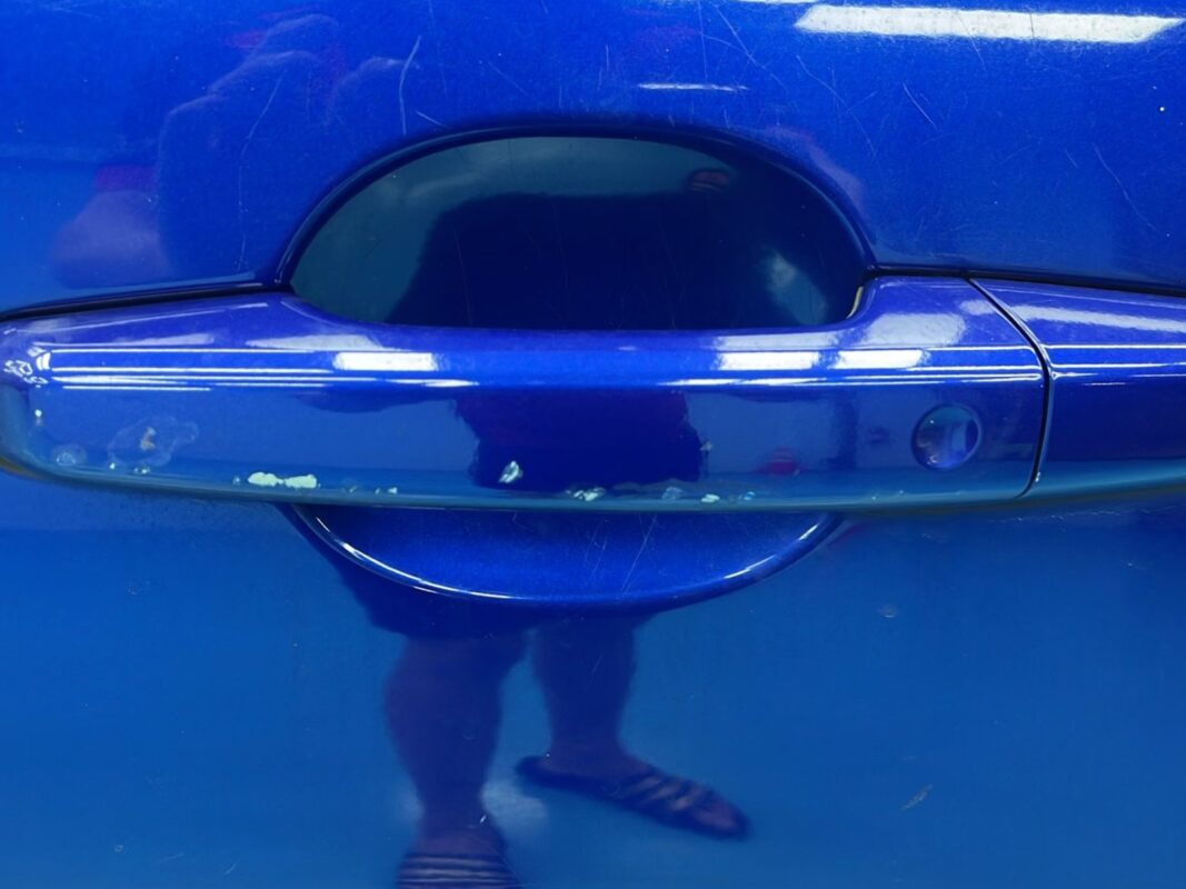 Further panel damage on the Jaguar XF, showing the extent of the deterioration.