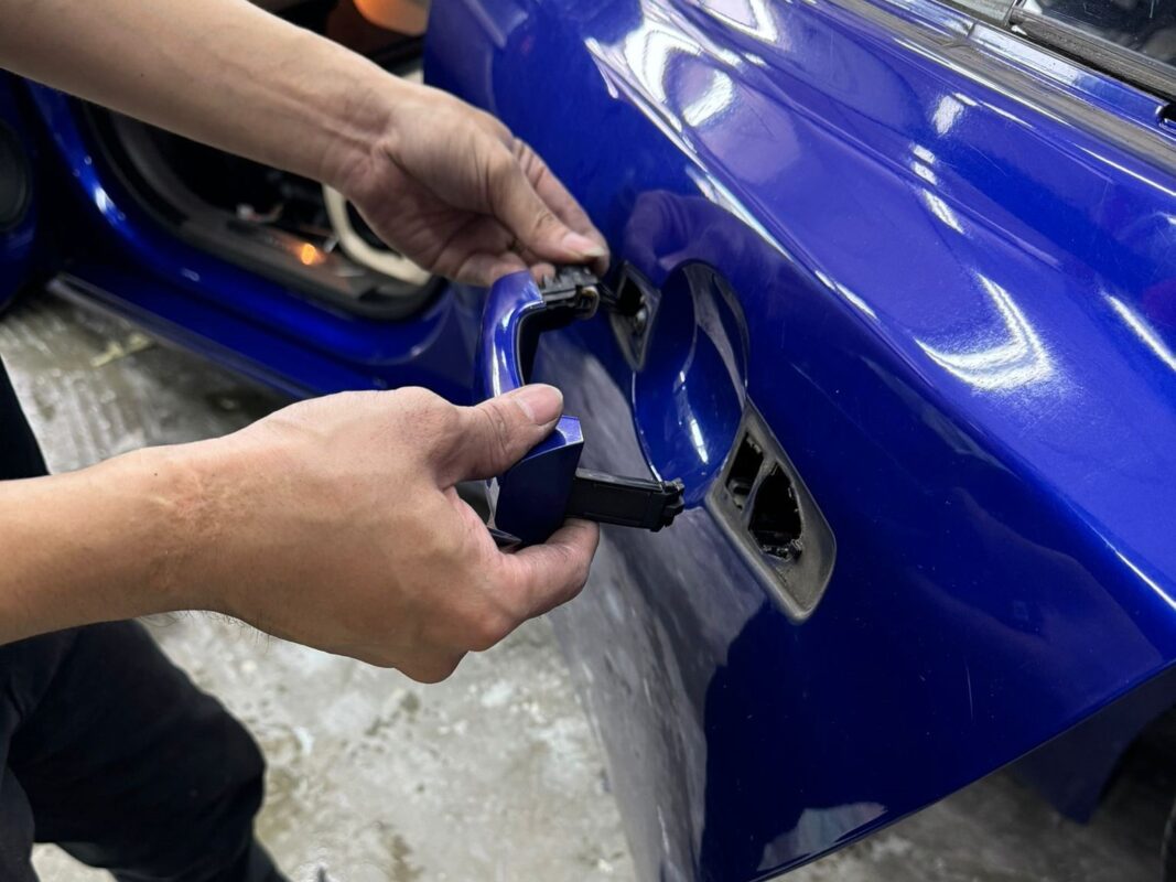Revol Carz specialists dismantling the Jaguar XF to begin the strip-down.