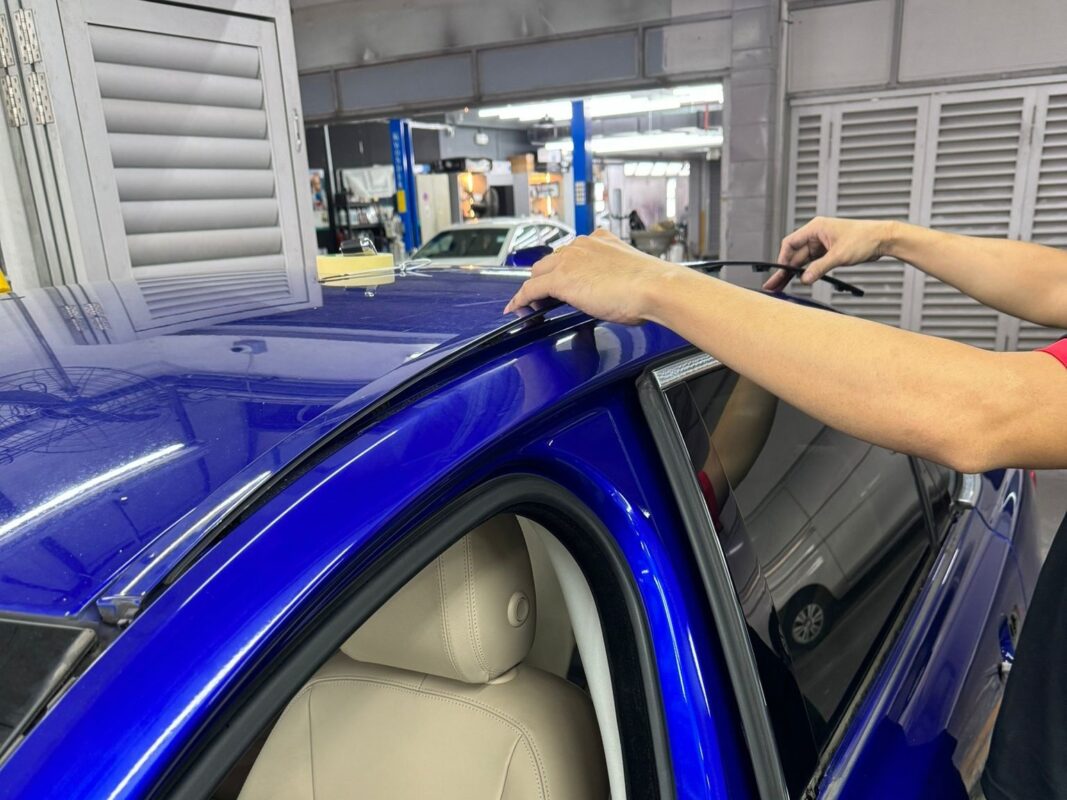 The Jaguar XF with panels exposed and prepared for bodywork.