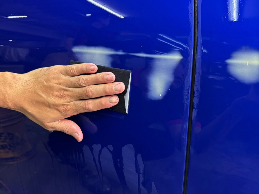 The Jaguar XF surface smooth and level after wet-sanding.