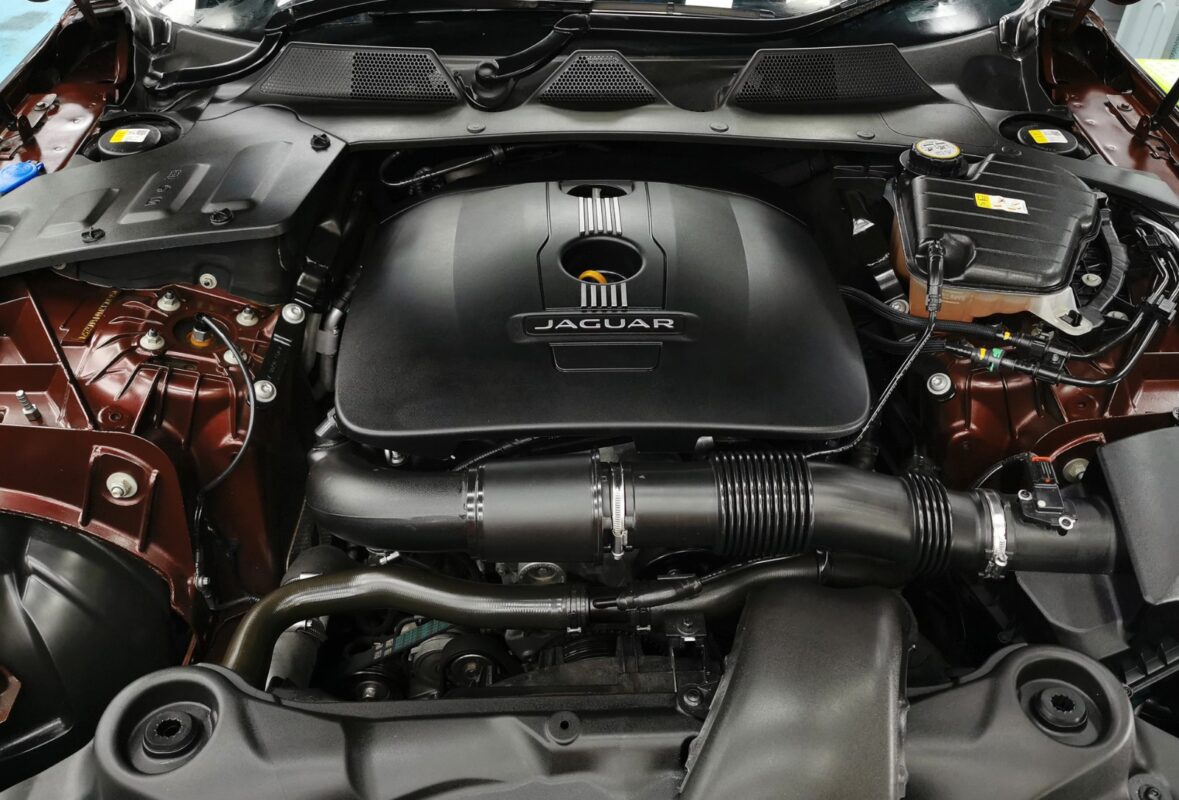 The Jaguar XJ's engine bay, clean after the work.