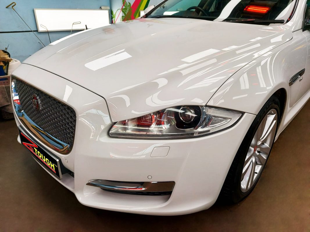 The Jaguar XJ from a side angle after the ceramic coating.
