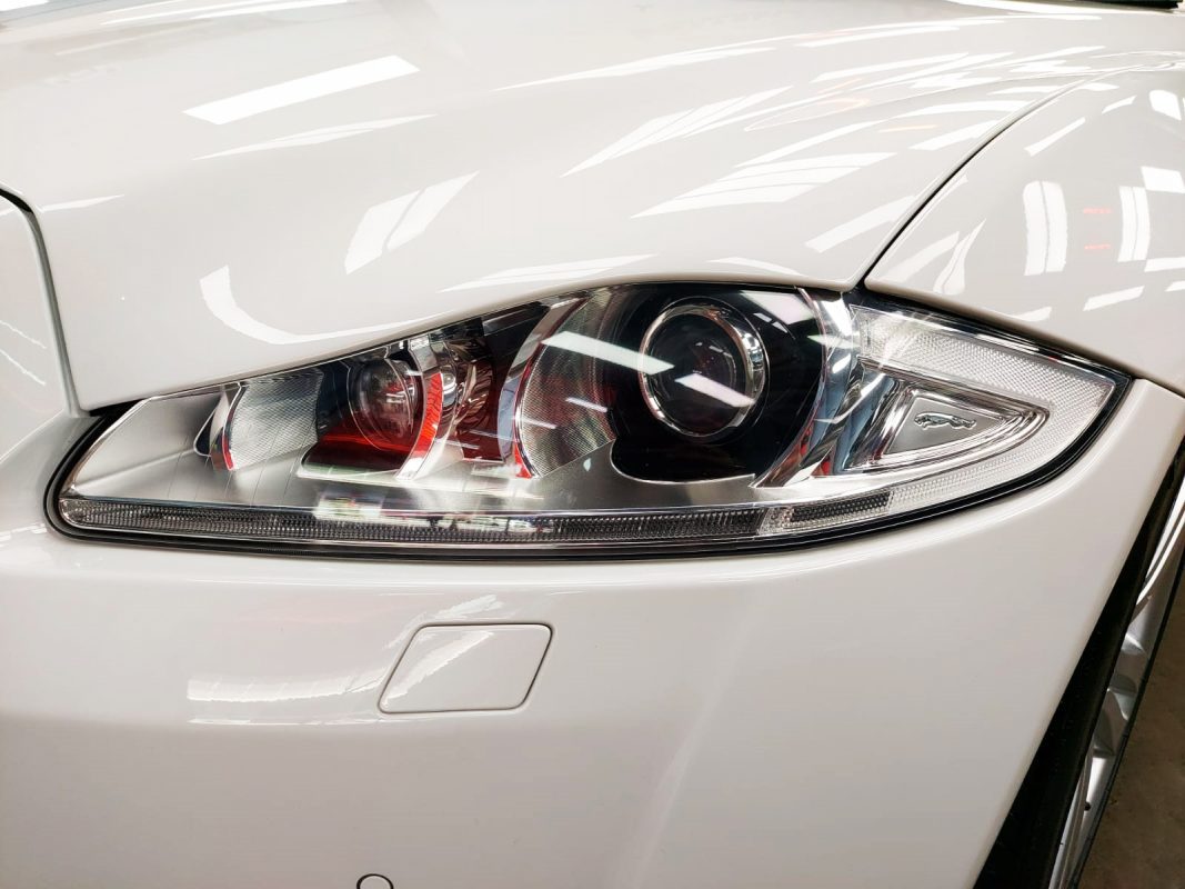 The XJ's coated paintwork showing clean reflections.