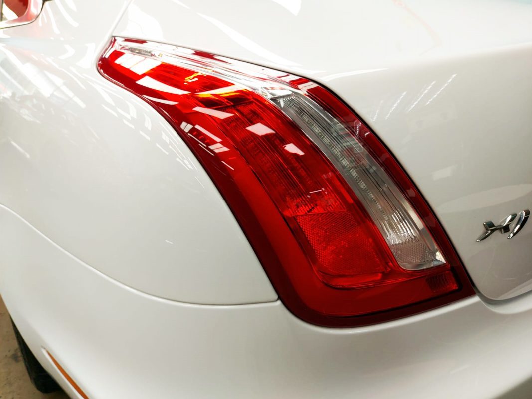 Rear quarter of the Jaguar XJ, glossy and protected.