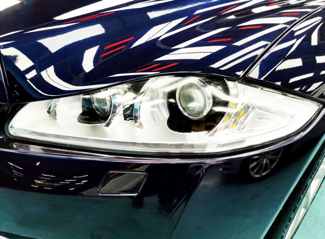 The XJ's coated paintwork showing clean reflections.