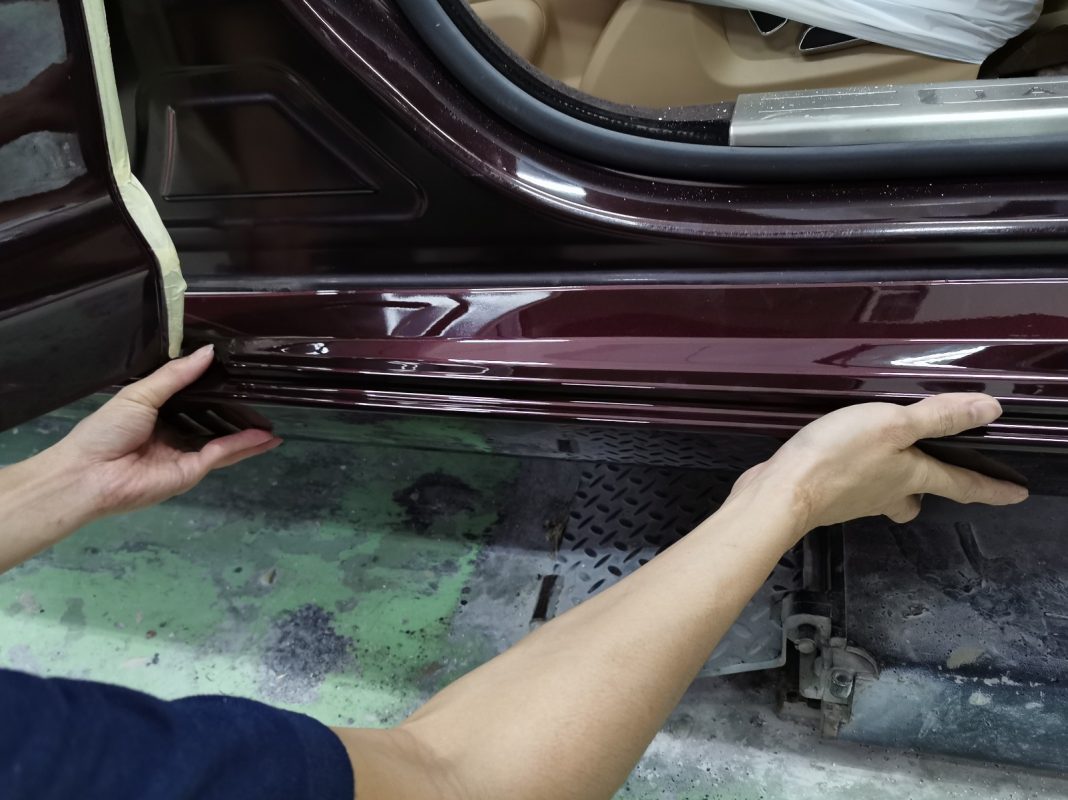 Polishing the new paint on the XJL to bring up the shine.