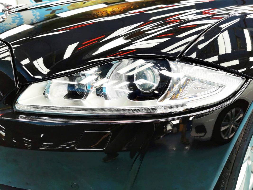 The XJL's coated paintwork showing clean reflections.