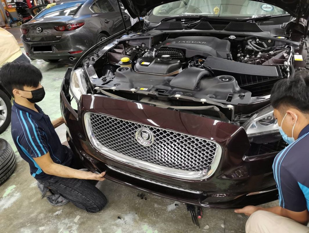 Jaguar XJL at the start of prep work in the workshop.