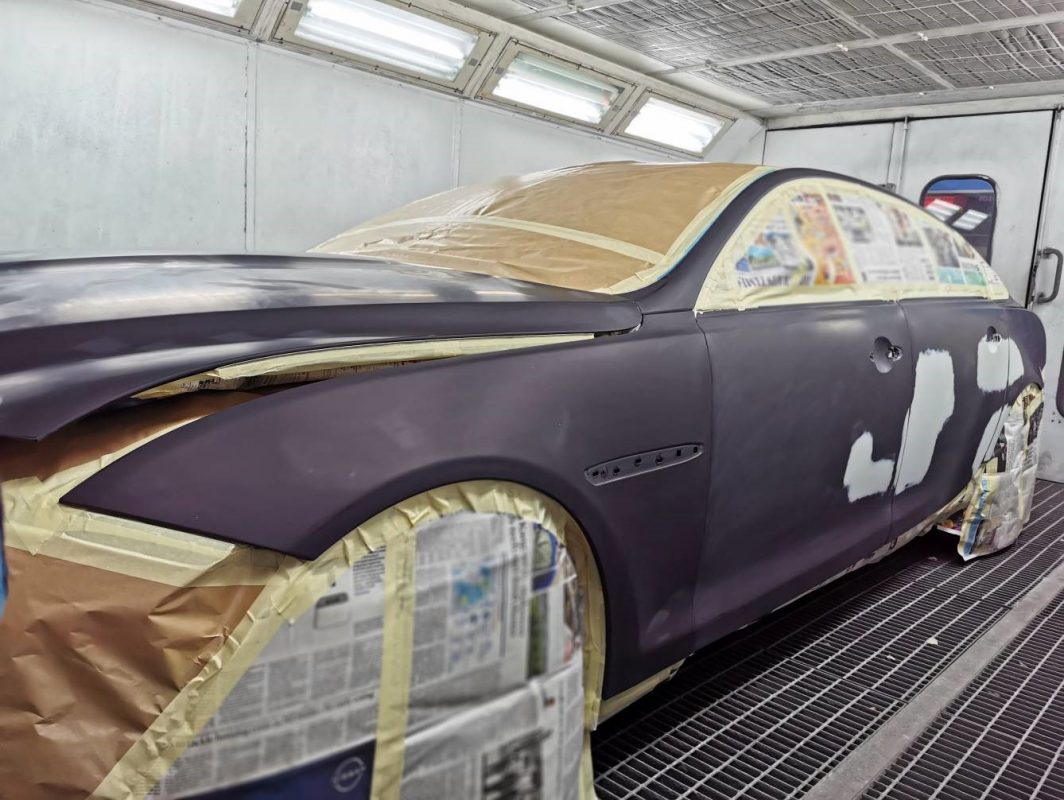 Spraying in progress on the Jaguar XJL bodywork.