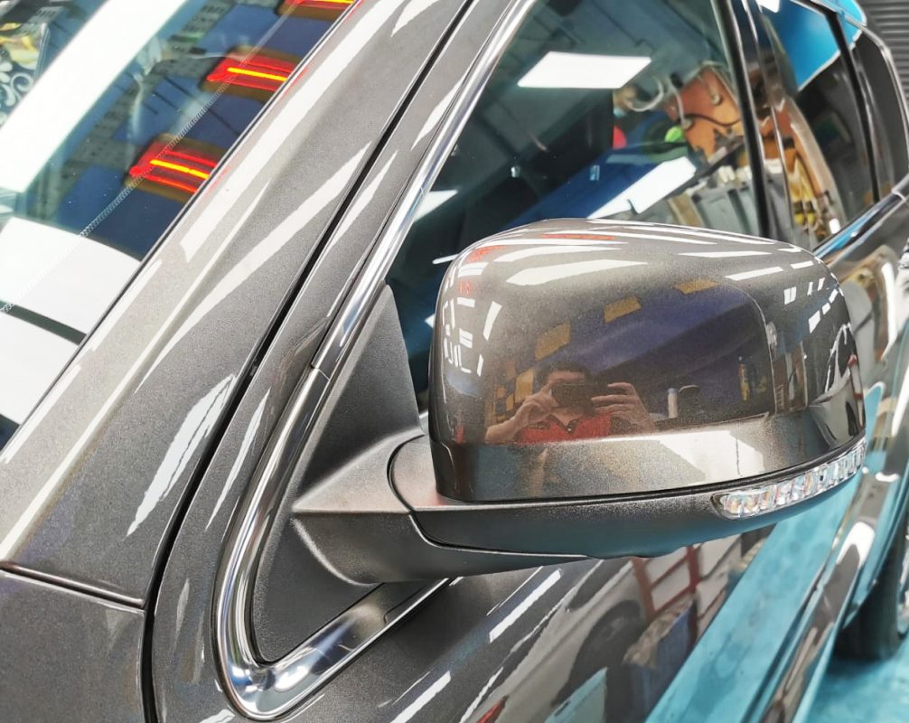Rear quarter of the Jeep Grande Cherokee, glossy and protected.