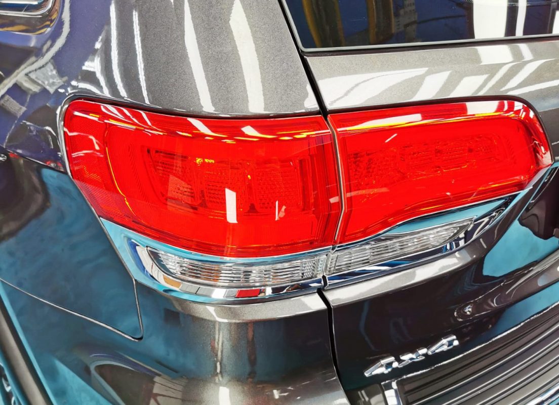 Bonnet of the Jeep Grande Cherokee under workshop lighting.