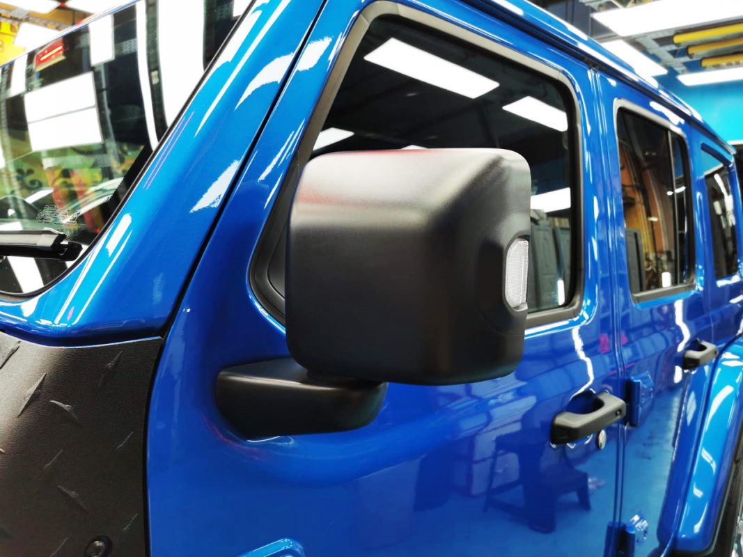 Rear quarter of the Jeep Wrangler, glossy and protected.