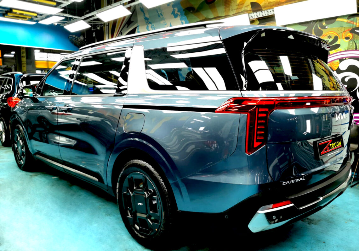 Rear quarter of the Kia Carnival, glossy and protected.