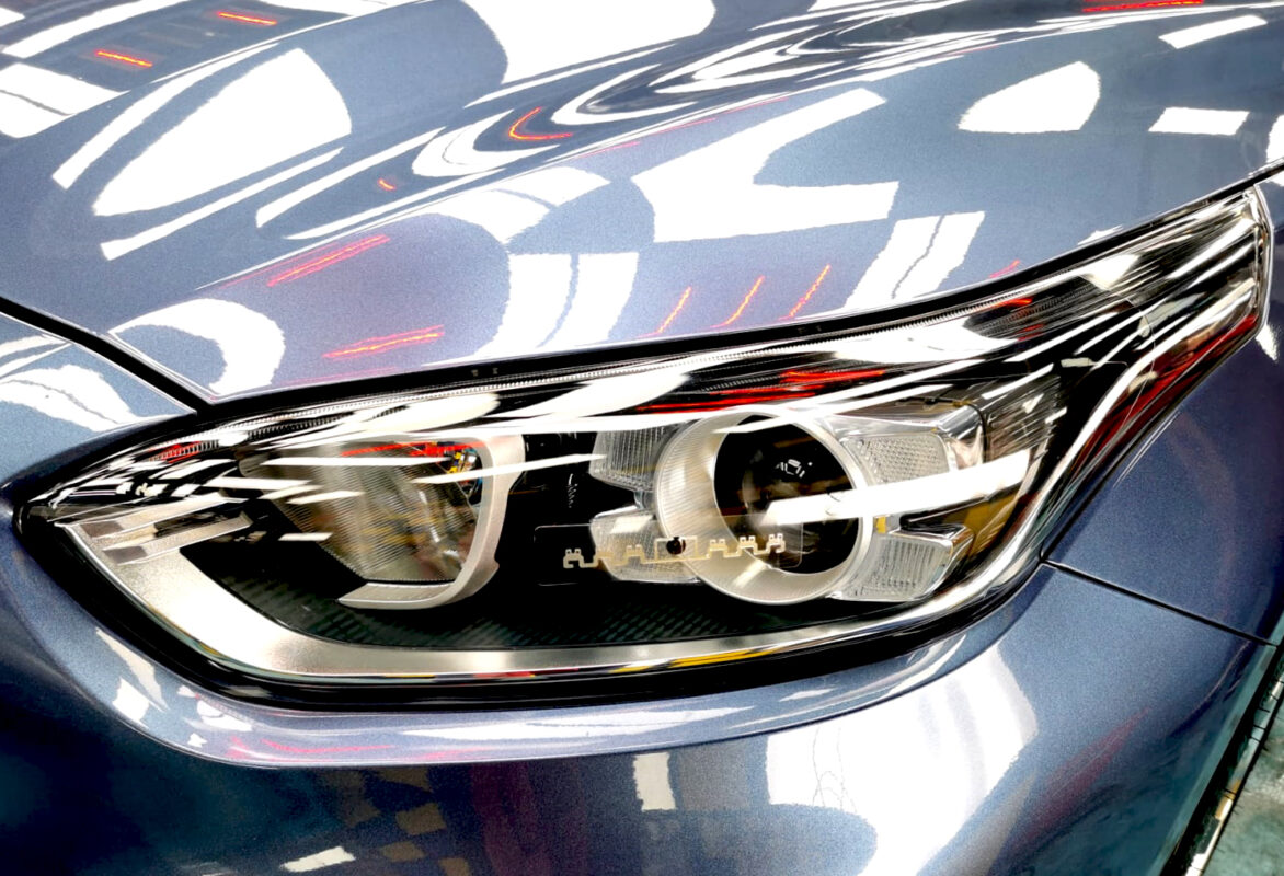 The Cerato's coated paintwork holding clean reflections.