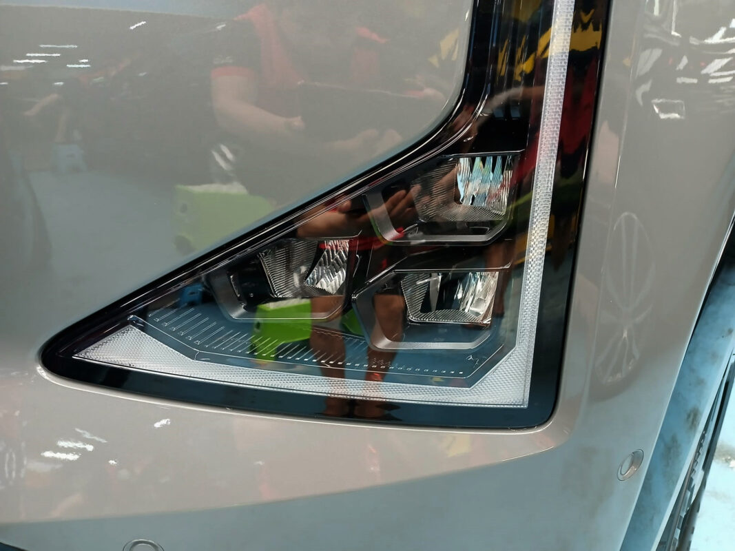 The EV5's coated paintwork holding clean reflections.